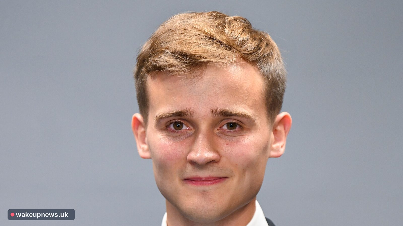 Transport minister Keir Mather in a dark suit and white shirt against a grey background